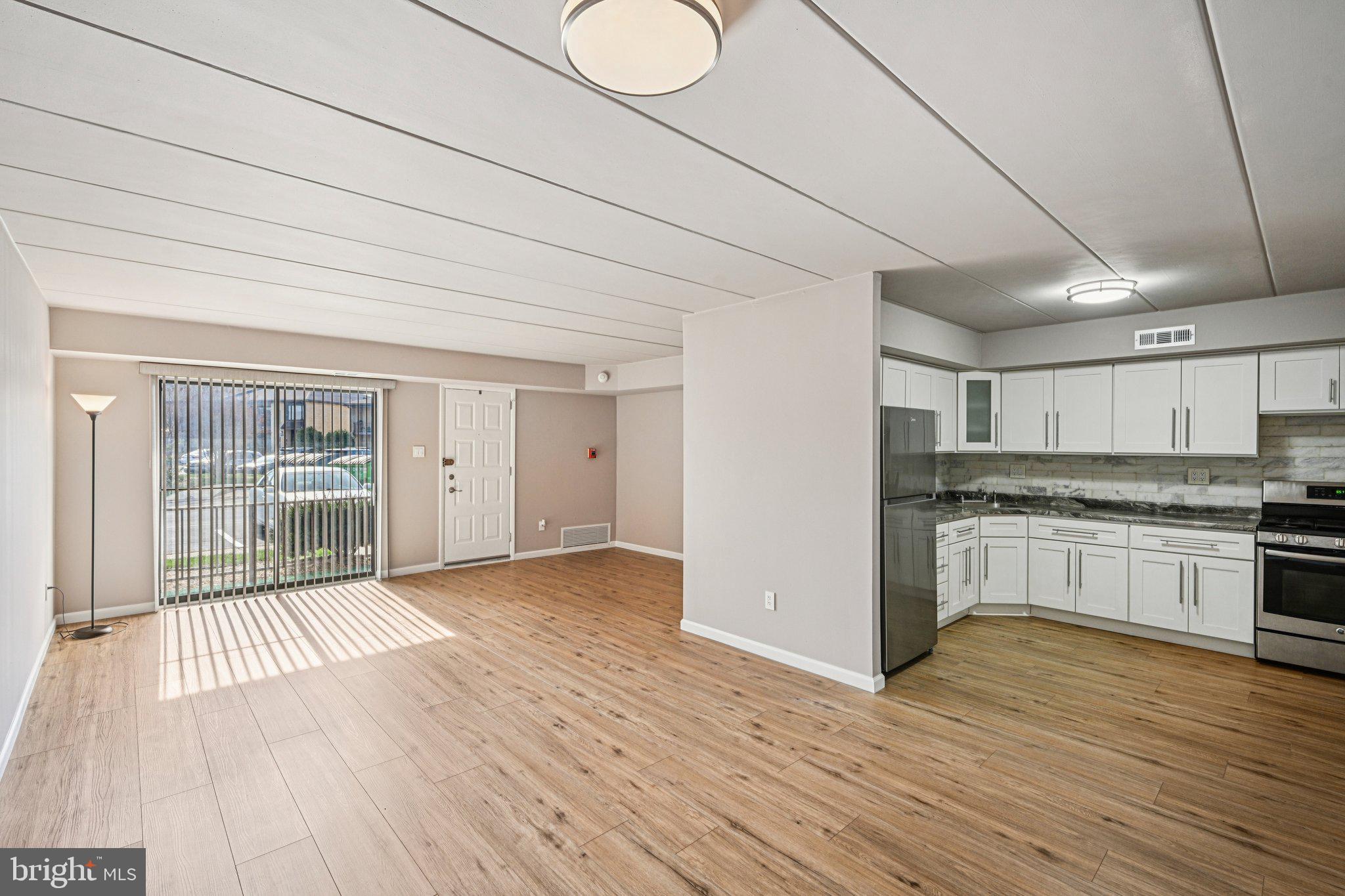 9906 Bustleton Avenue, Unit C25 Philadelphia, PA 19115 - Photo 26 of 26 a view of a kitchen with a sink and a stove top oven