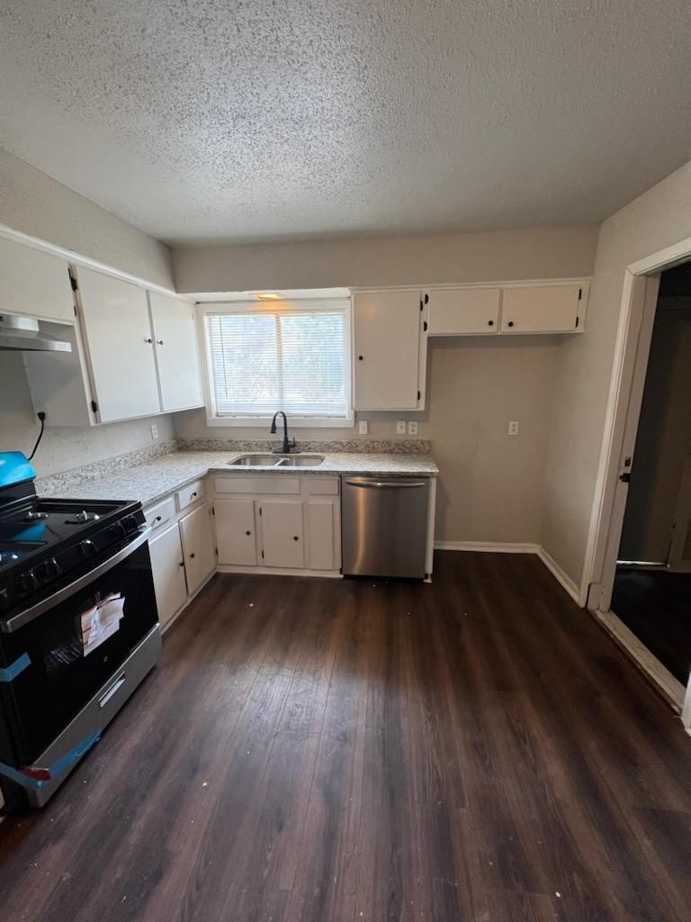 9306 St Lo Road Houston, TX 77033 - Photo 4 of 13 Kitchen with granite countertops and new flooring