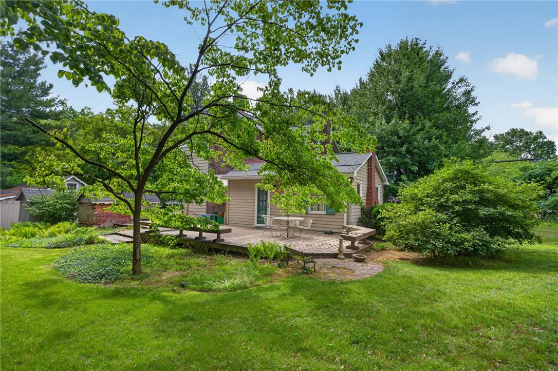 765 East Macada Road Bethlehem, PA 18017 - Photo 8 of 46 A verdant yard offers a delightful wooden deck for outdoor enjoyment.