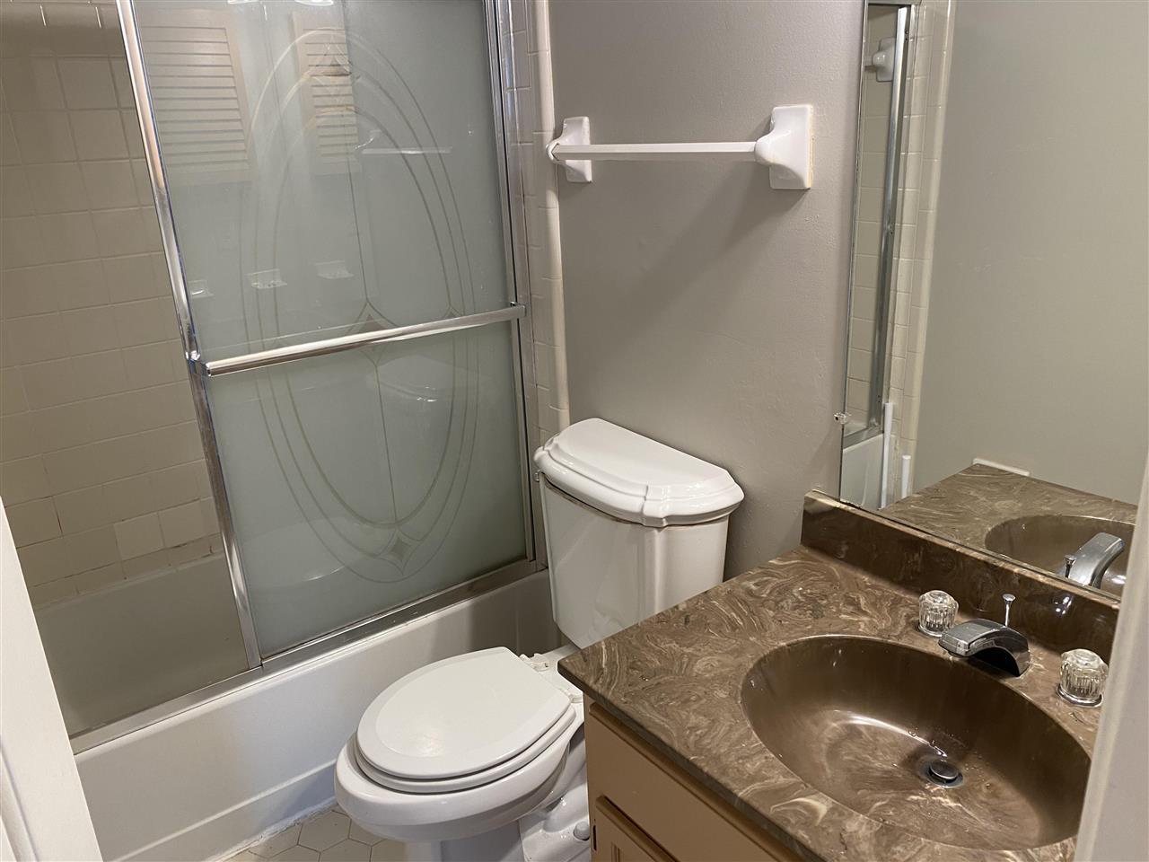 198 South Walnut Bend Road Memphis, TN 38018 - Photo 14 of 18 a white toilet sitting next to a bathroom sink