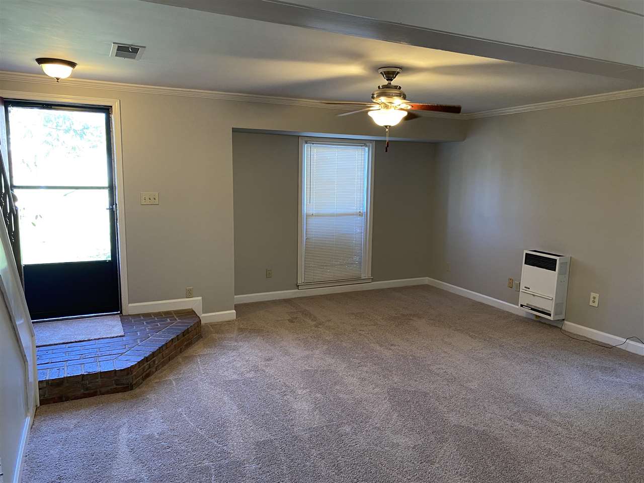 198 South Walnut Bend Road Memphis, TN 38018 - Photo 4 of 18 a view of an empty room with a chandelier fan