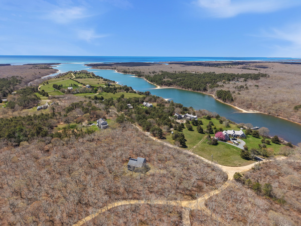 82 Oyster Pond Road Edgartown, MA 02539 - Photo 24 of 53 a view of a lake with a mountain in the background