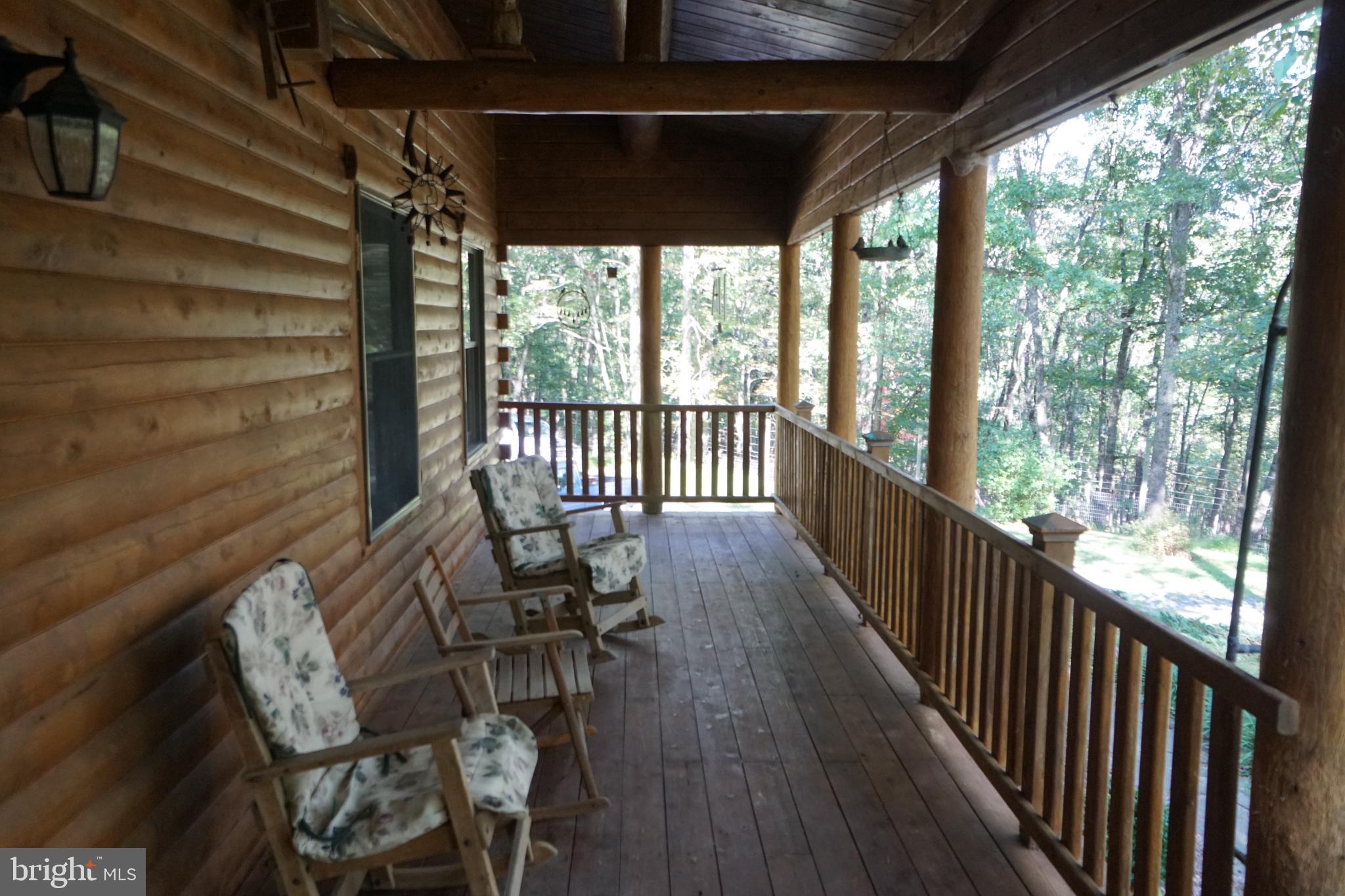 1537 Hidden Valley Road Franklin, WV 26807 - Photo 19 of 78 Serene porch overlooking lush greenery.