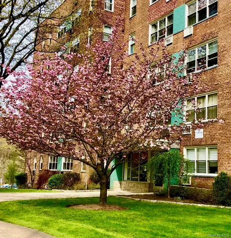 front view of a building with a yard