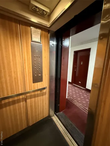 a view of walk in closet with clothes