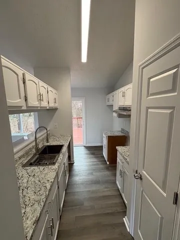 a kitchen with granite countertop lots of counter top space