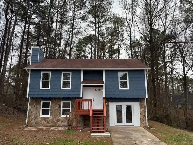 a front view of a house with garden