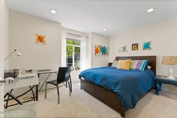 a bedroom with a bed and a table in it