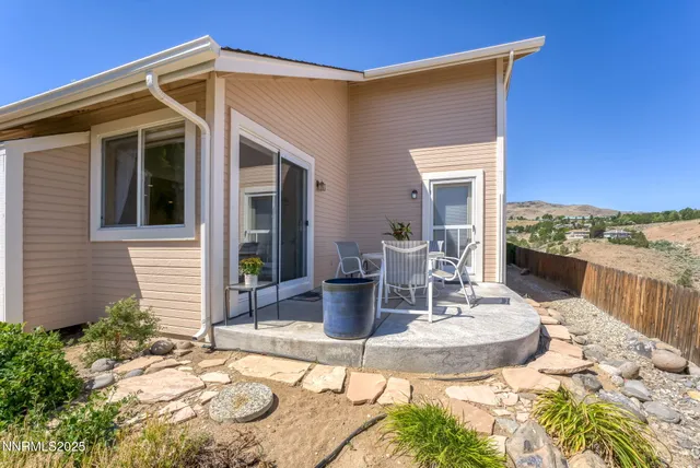 a view of a patio with couches table and chairs