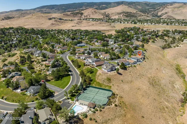 an aerial view of a house with a garden