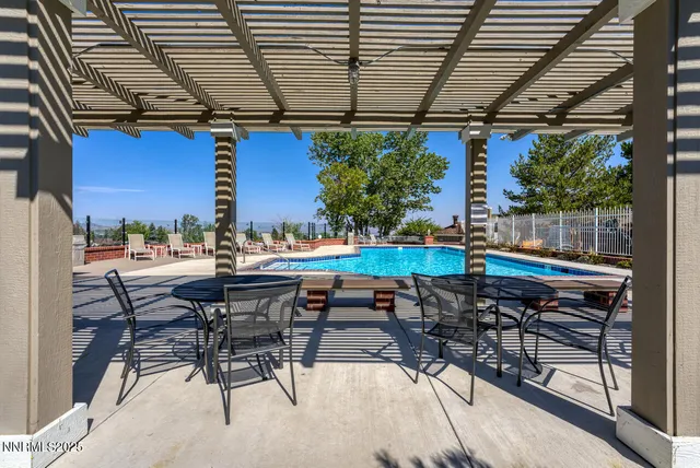 a view of a swimming pool with a patio