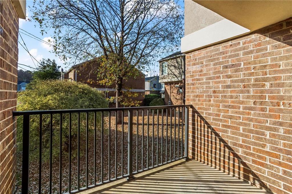3301 Henderson Mill Road, Unit L4 Atlanta, GA 30341 - Photo 14 of 33 a view of a balcony with wooden floor