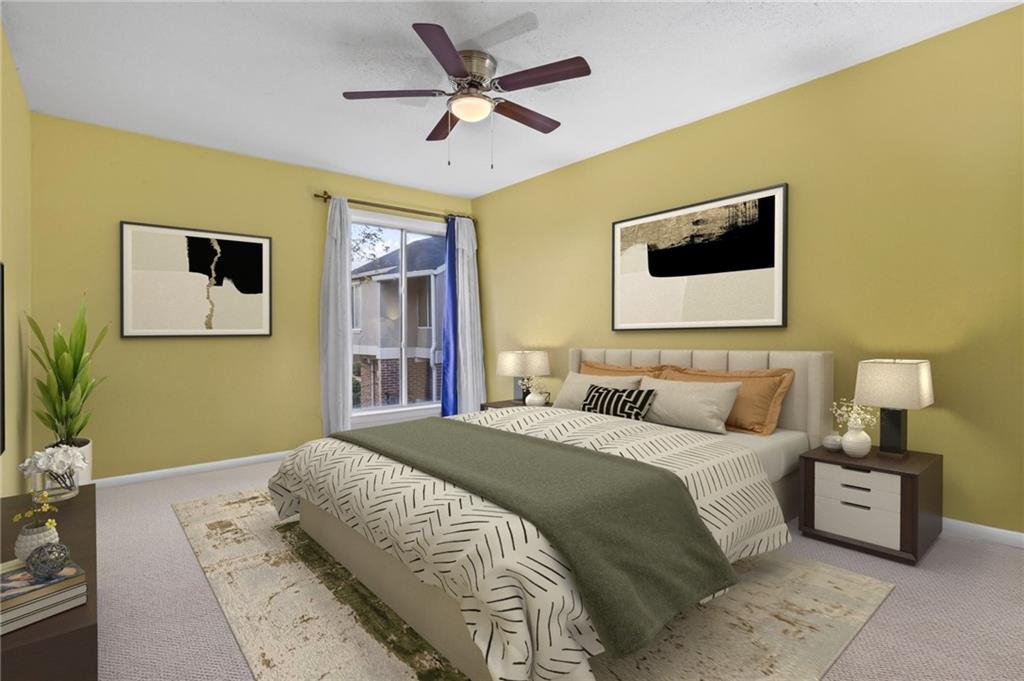 3301 Henderson Mill Road, Unit L4 Atlanta, GA 30341 - Photo 16 of 33 a bedroom with a bed and a flat screen tv