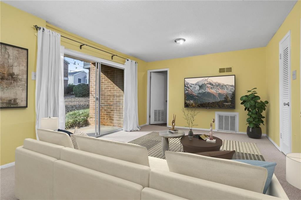 3301 Henderson Mill Road, Unit L4 Atlanta, GA 30341 - Photo 24 of 33 a living room with furniture and a large window
