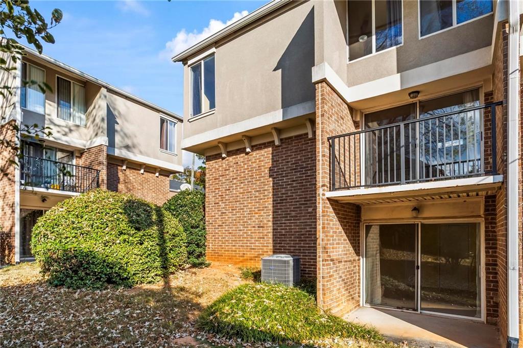 3301 Henderson Mill Road, Unit L4 Atlanta, GA 30341 - Photo 28 of 33 a front view of a residential apartment building with a yard