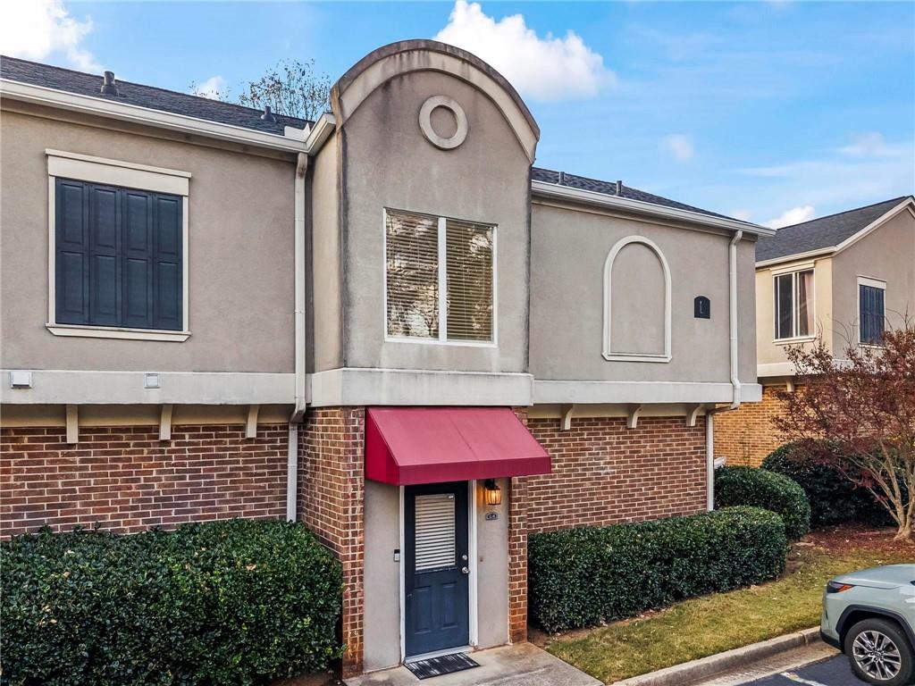 3301 Henderson Mill Road, Unit L4 Atlanta, GA 30341 - Photo 31 of 33 a front view of a house with parking space