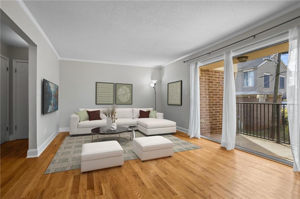 3301 Henderson Mill Road, Unit L4 Atlanta, GA 30341 - Photo 7 of 33 a living room with furniture and a flat screen tv