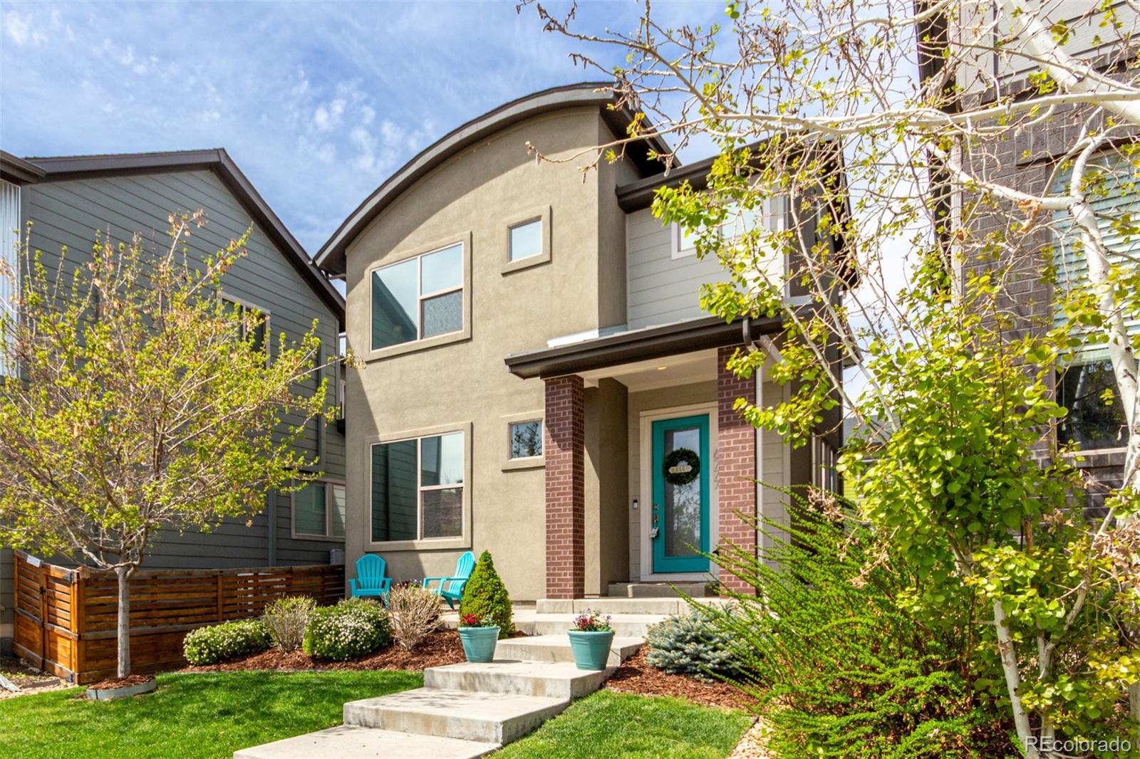 6777 Larsh Drive Denver, CO 80221 - Photo 1 of 48 front view of a house with a yard