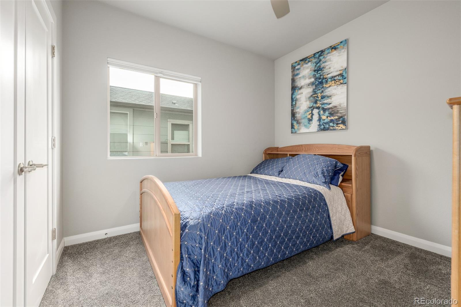 6777 Larsh Drive Denver, CO 80221 - Photo 29 of 48 a bedroom with a bed and a window