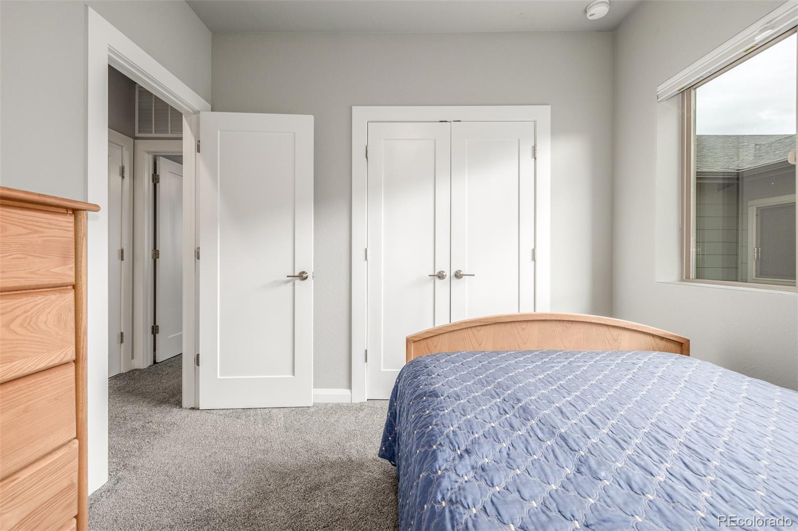 6777 Larsh Drive Denver, CO 80221 - Photo 30 of 48 a bedroom with a bed and a window