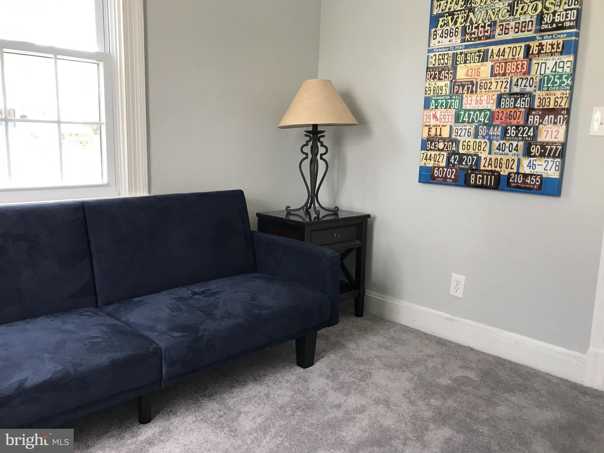 10 Crafton Road Baltimore, MD 21221 - Photo 14 of 28 a living room with furniture and a window