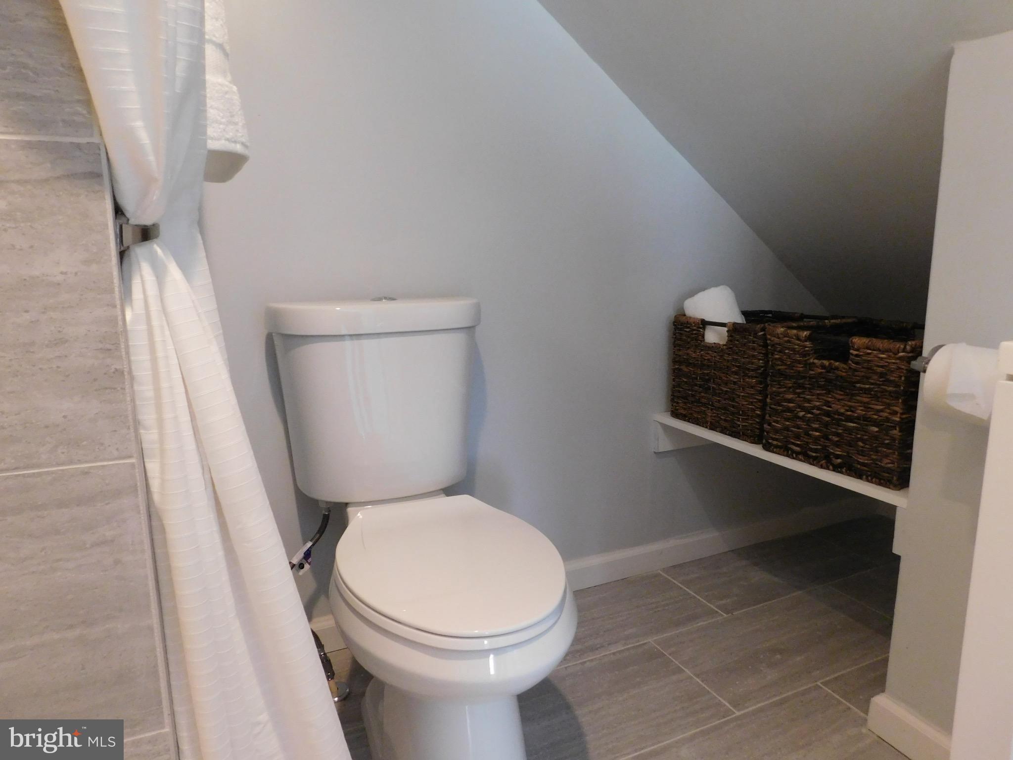 10 Crafton Road Baltimore, MD 21221 - Photo 22 of 28 a bathroom with a toilet and a shower