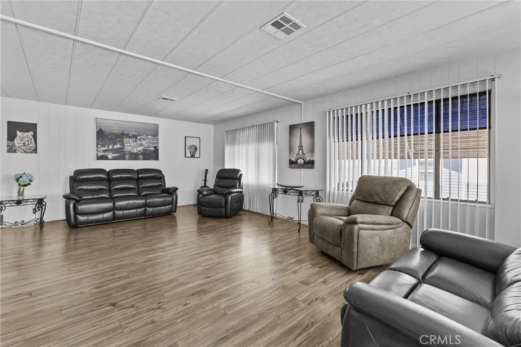 4000 Pierce Street, Unit 132 Riverside, CA 92505 - Photo 10 of 43 a living room with furniture and a large window