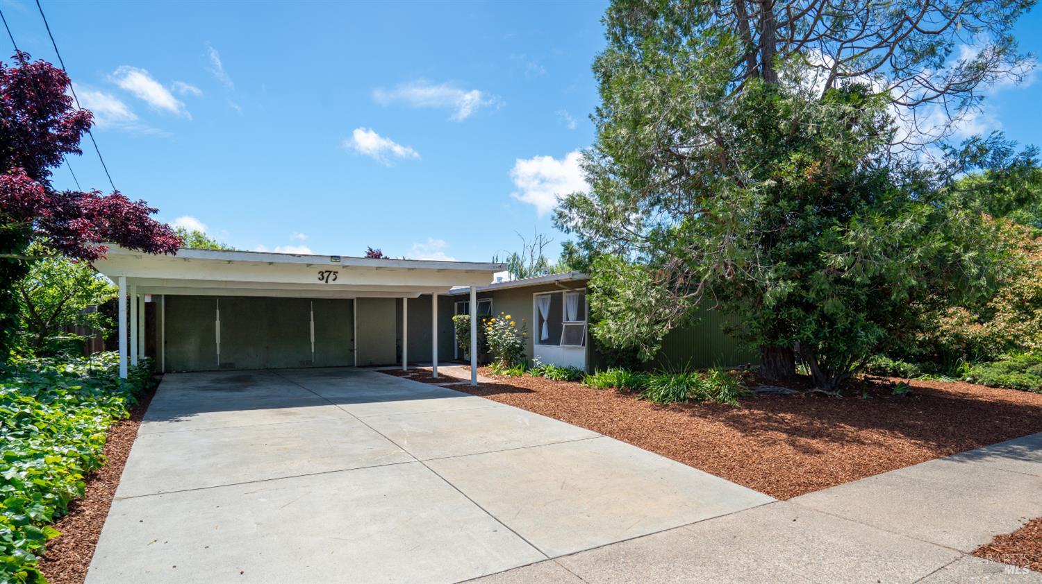 375 Las Colindas Road San Rafael, CA 94903 - Photo 1 of 1 a front view of a house with a yard