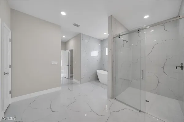 a bathroom with a shower and toilet