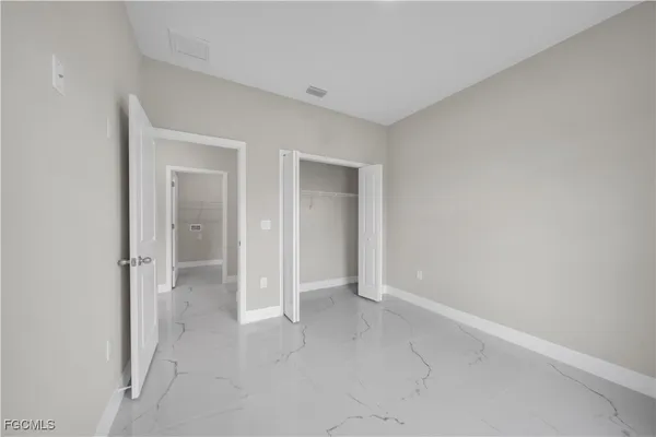 wooden floor and closet in a room