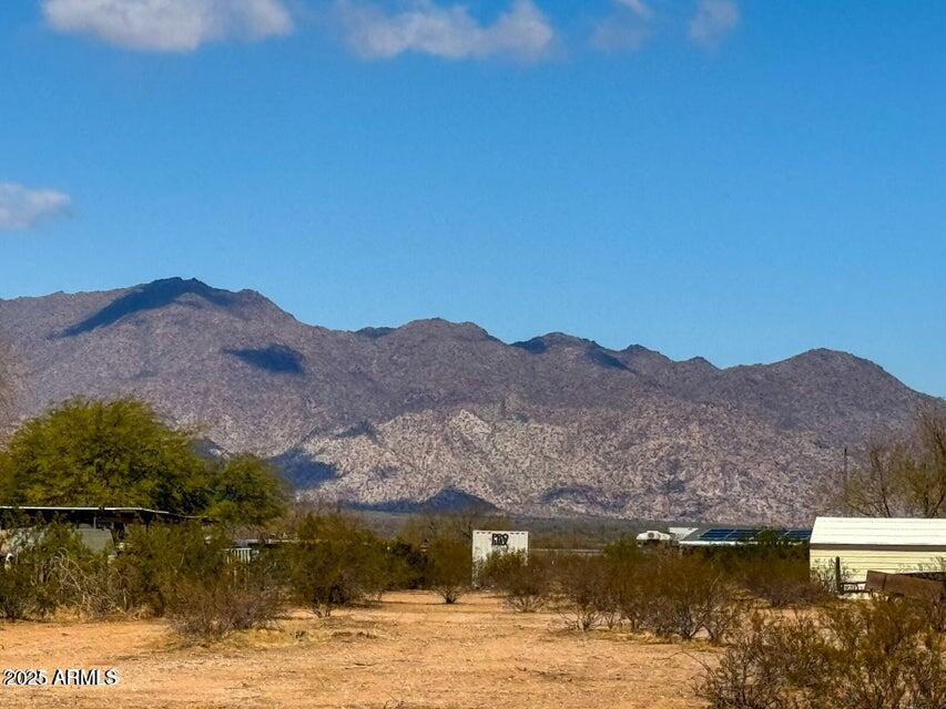 a view of a town with mountains in the background