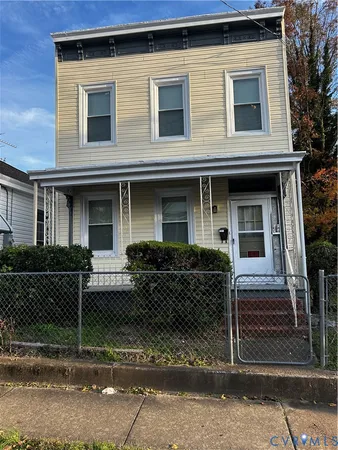 a front view of a house with garage