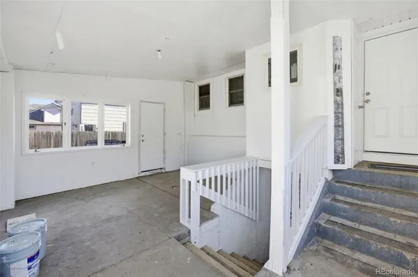 a view of a hallway with windows
