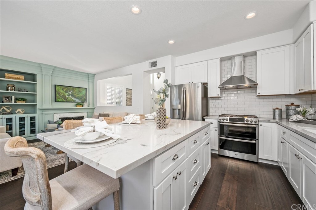 4350 Milano Way Oceanside, CA 92057 - Photo 12 of 30 a kitchen that has a sink a stove and chairs