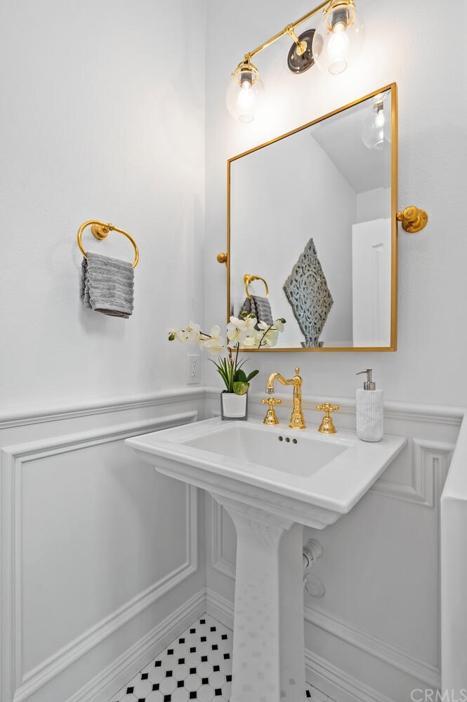 4350 Milano Way Oceanside, CA 92057 - Photo 13 of 30 a bathroom with a sink and a mirror