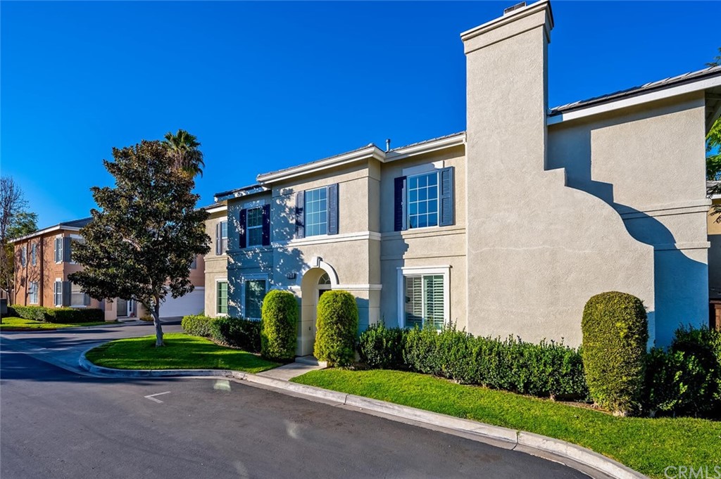 4350 Milano Way Oceanside, CA 92057 - Photo 2 of 30 a front view of a house with garden