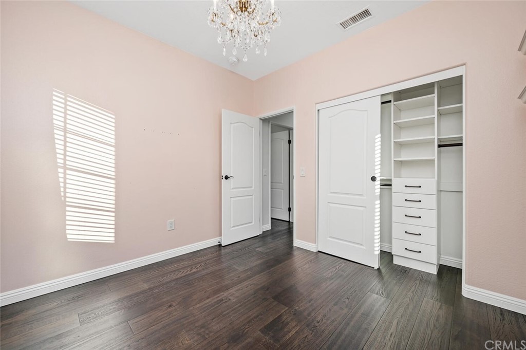 4350 Milano Way Oceanside, CA 92057 - Photo 21 of 30 wooden floor in an empty room with a window