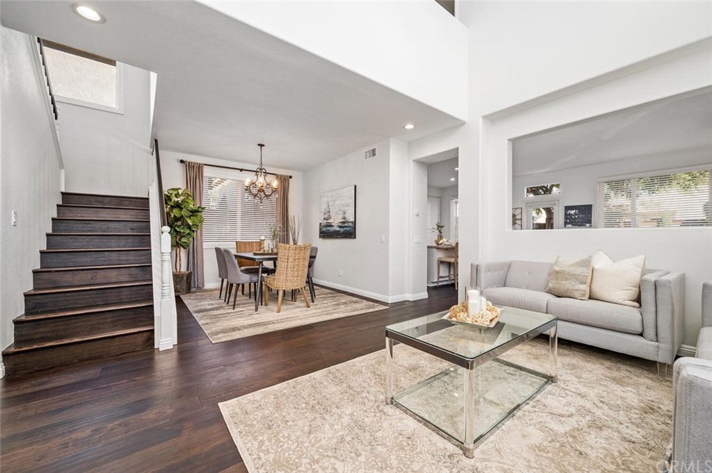 4350 Milano Way Oceanside, CA 92057 - Photo 3 of 30 a living room with furniture and wooden floor