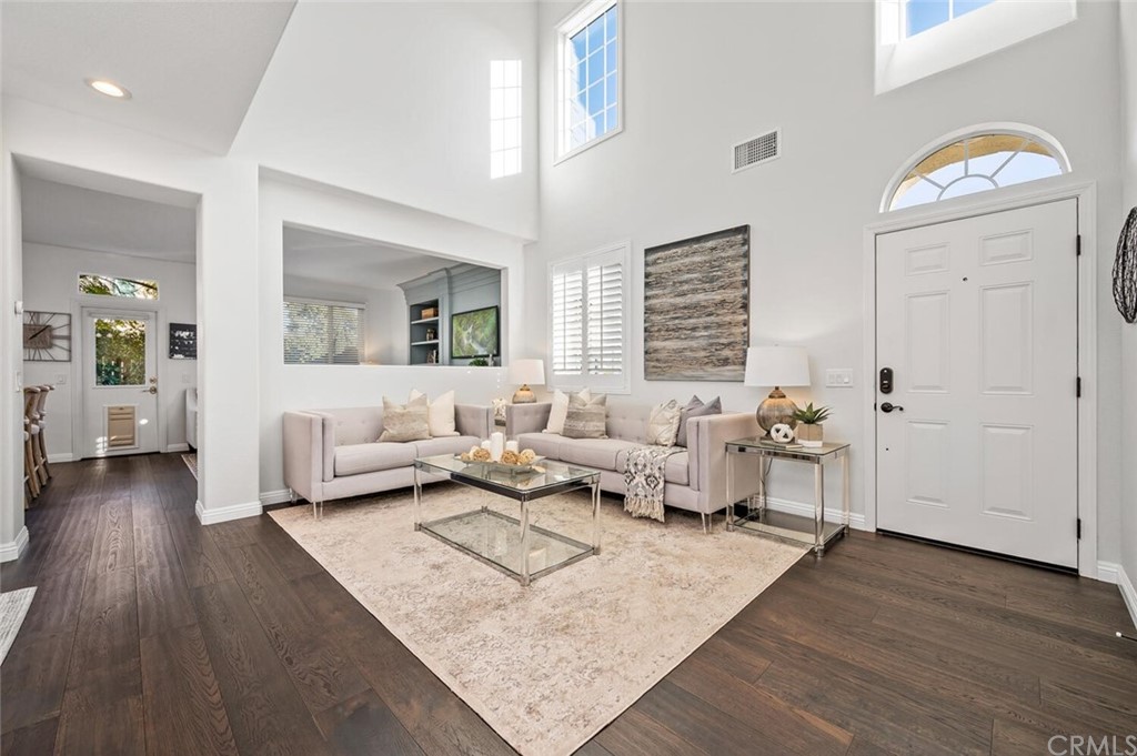 4350 Milano Way Oceanside, CA 92057 - Photo 4 of 30 a living room with furniture and wooden floor