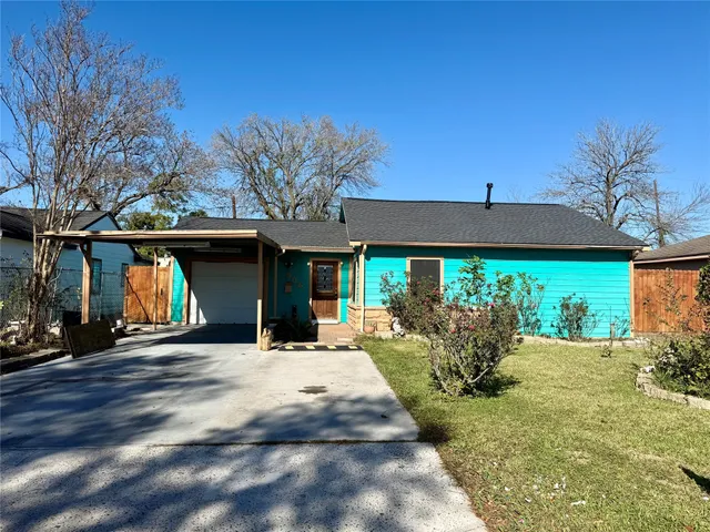 a front view of a house with garden and patio