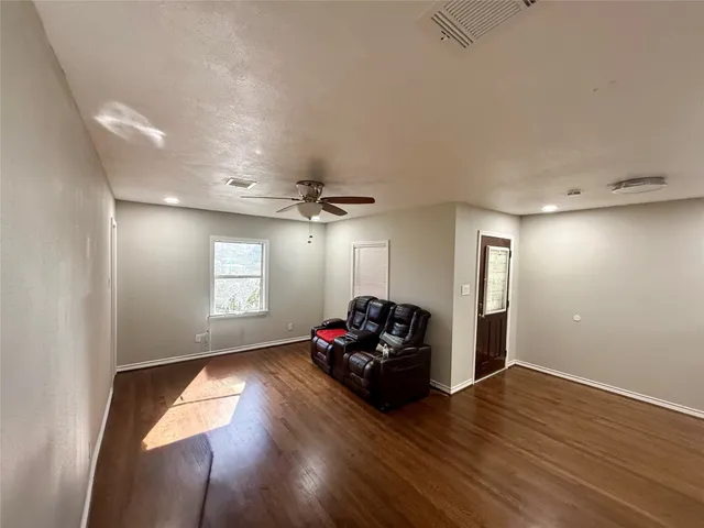 a kitchen with stainless steel appliances granite countertop a refrigerator and a stove
