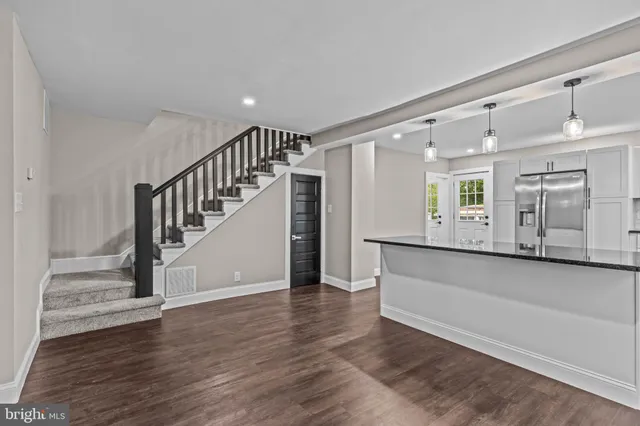 a view of an entryway with wooden floor