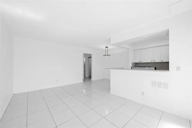 a view of kitchen with white cabinets