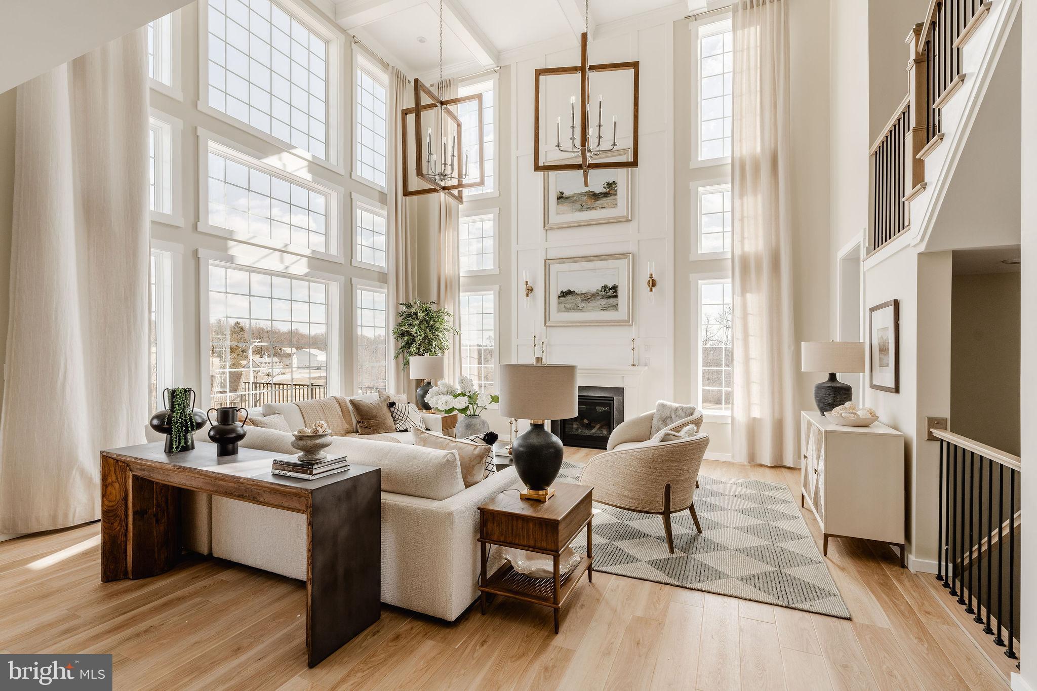 610 East Tolna Road, Unit DEVONSHIRE Shrewsbury, PA 17361 - Photo 21 of 50 a living room with furniture large window and wooden floor