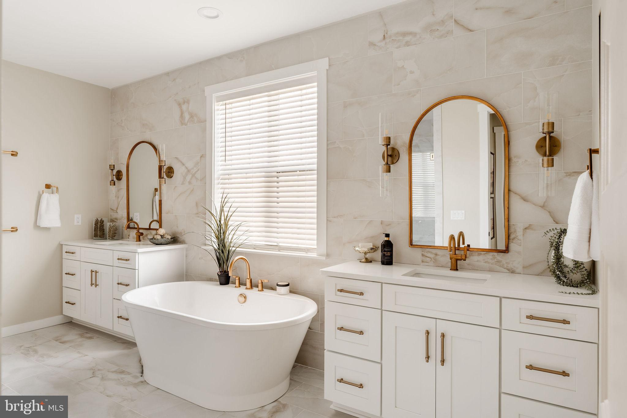 610 East Tolna Road, Unit DEVONSHIRE Shrewsbury, PA 17361 - Photo 38 of 50 a bathroom with a double vanity sink mirror and bathtub