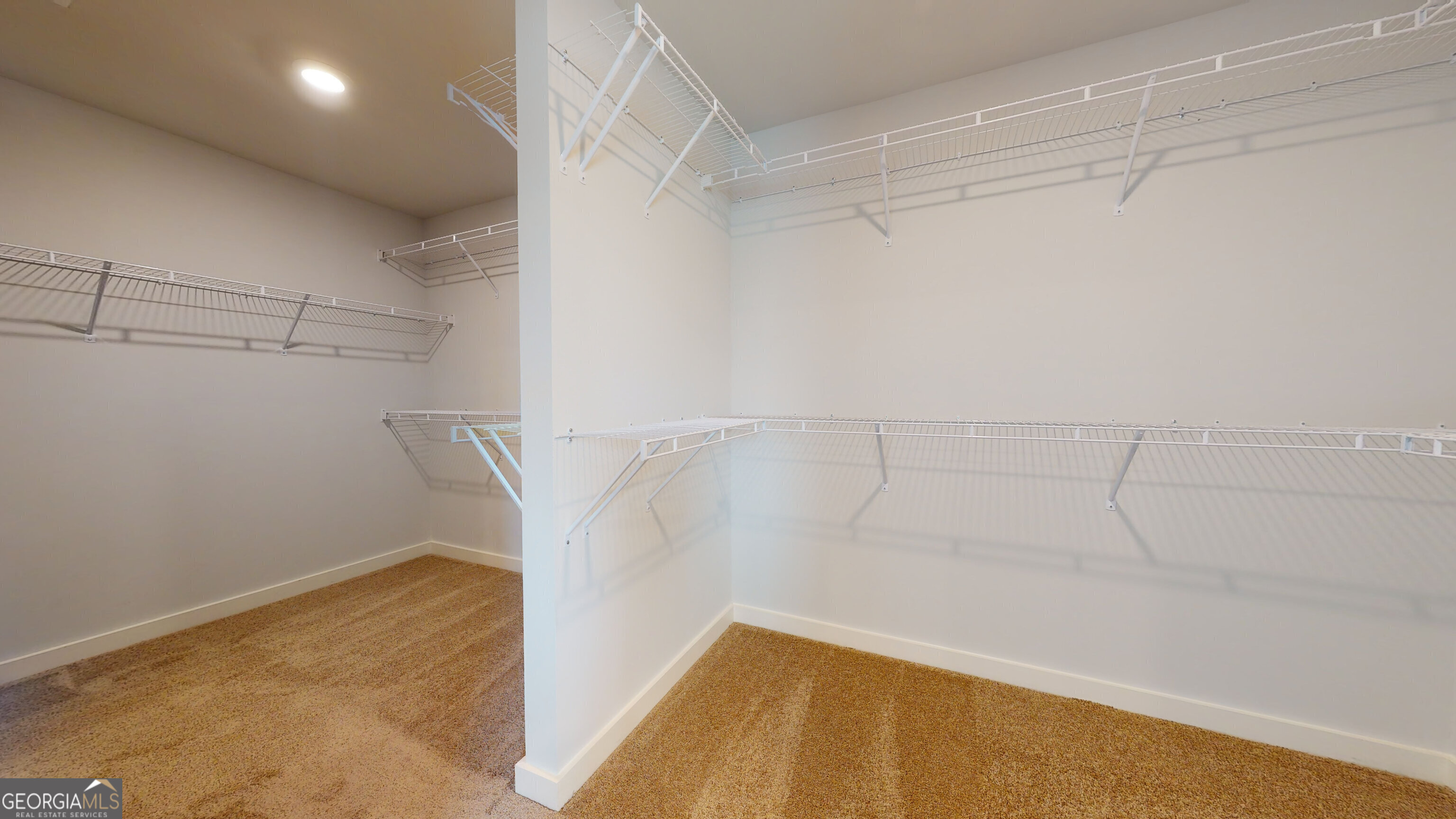 366 Jarrett Street Fairburn, GA 30213 - Photo 11 of 18 a view of a room with racks on the wall