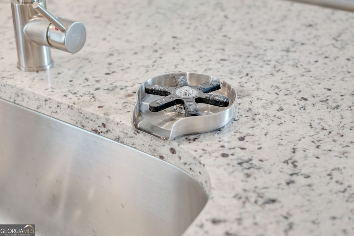 366 Jarrett Street Fairburn, GA 30213 - Photo 13 of 18 a bathroom with a sink and a mirror