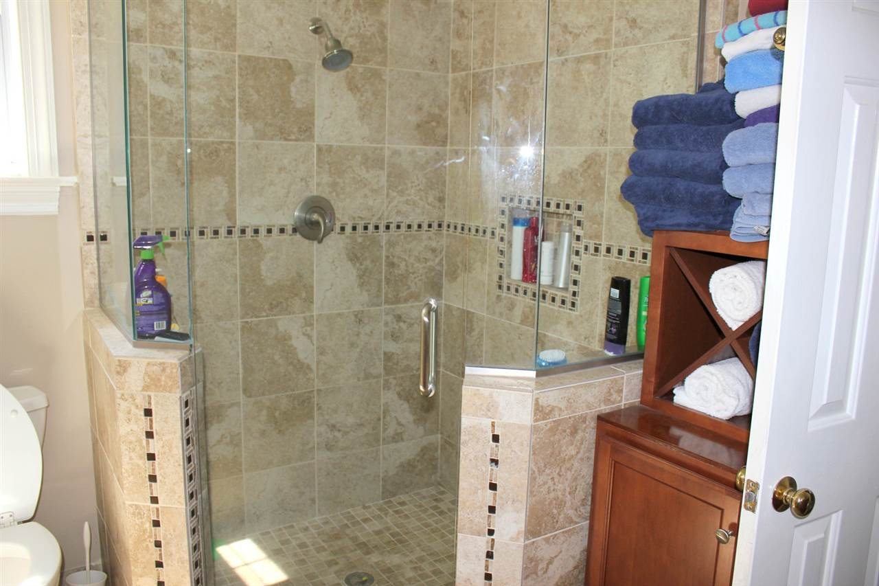 9401 Does Run Court Raleigh, NC 27613 - Photo 11 of 25 Beautifully Tiled Shower in Master Bath