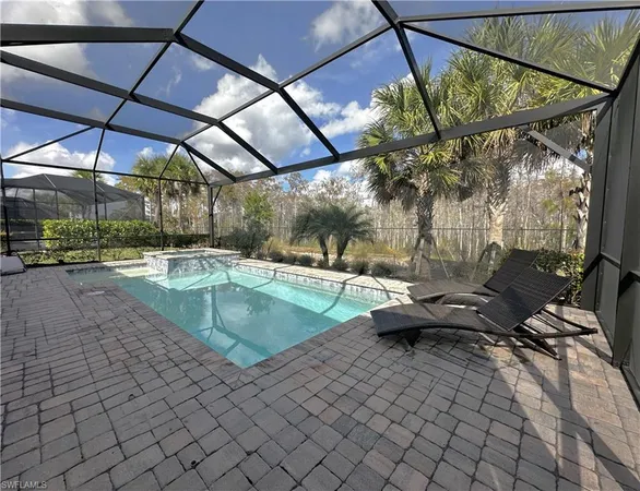 a view of swimming pool with a patio