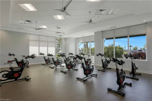 a gym room with lots of gym equipment